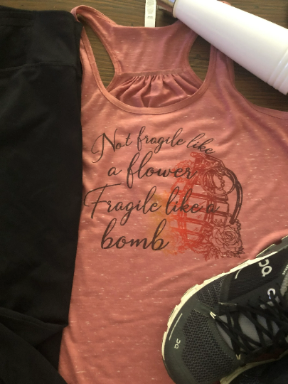 Not fragile like a flower Fragile like a bomb Bella Racerback Tank